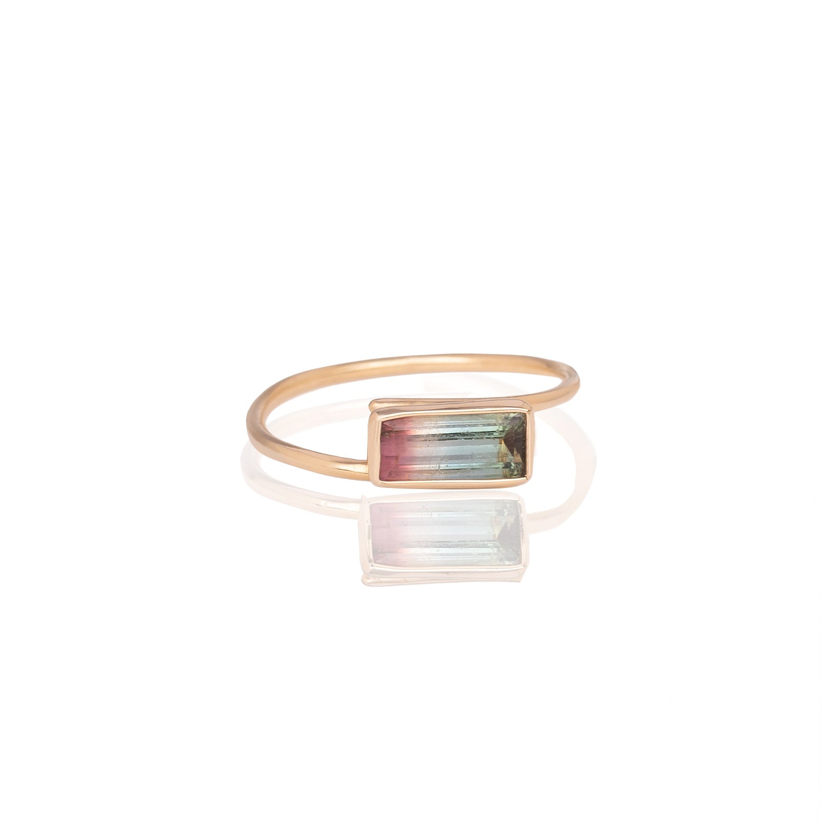 bicolor tourmaline embraced in 14k gold