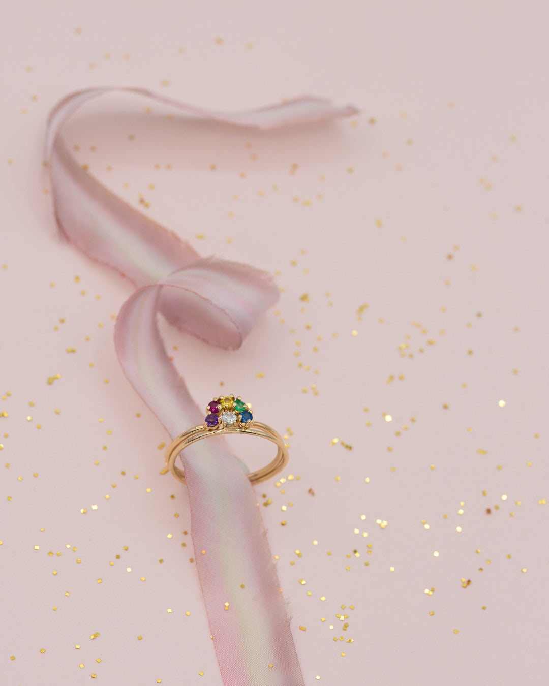 stacked rainbow gold ring with white sapphire ring