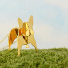 gold frenchie necklace in grass