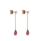 side view of diamond pink tourmaline teardrop earrings in 14k gold
